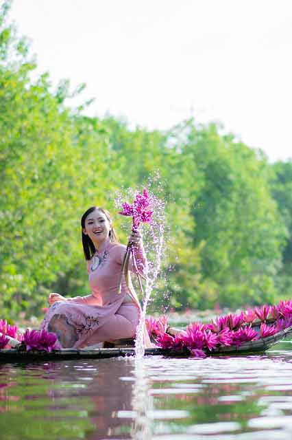 Vietnamese girl with flowers in her hand