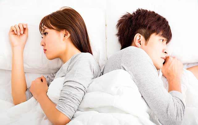 Vietnamese partner is losing interest: couple in bed together