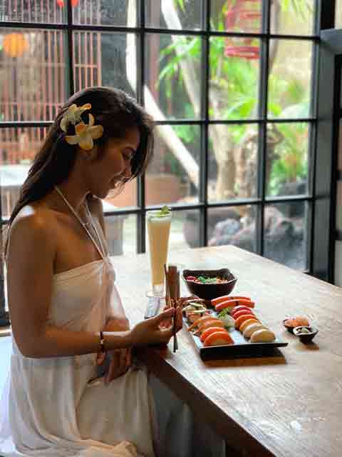 girl eating sushi